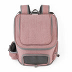 Pink pet carrier backpack with front mesh door, side pockets, and top opening
