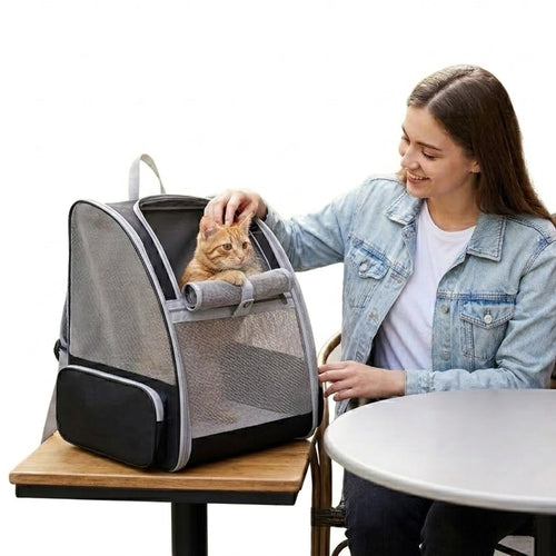 Woman interacting with cat inside breathable mesh pet carrier backpack