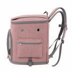 Pink pet carrier backpack with front mesh door, side pockets, and top opening