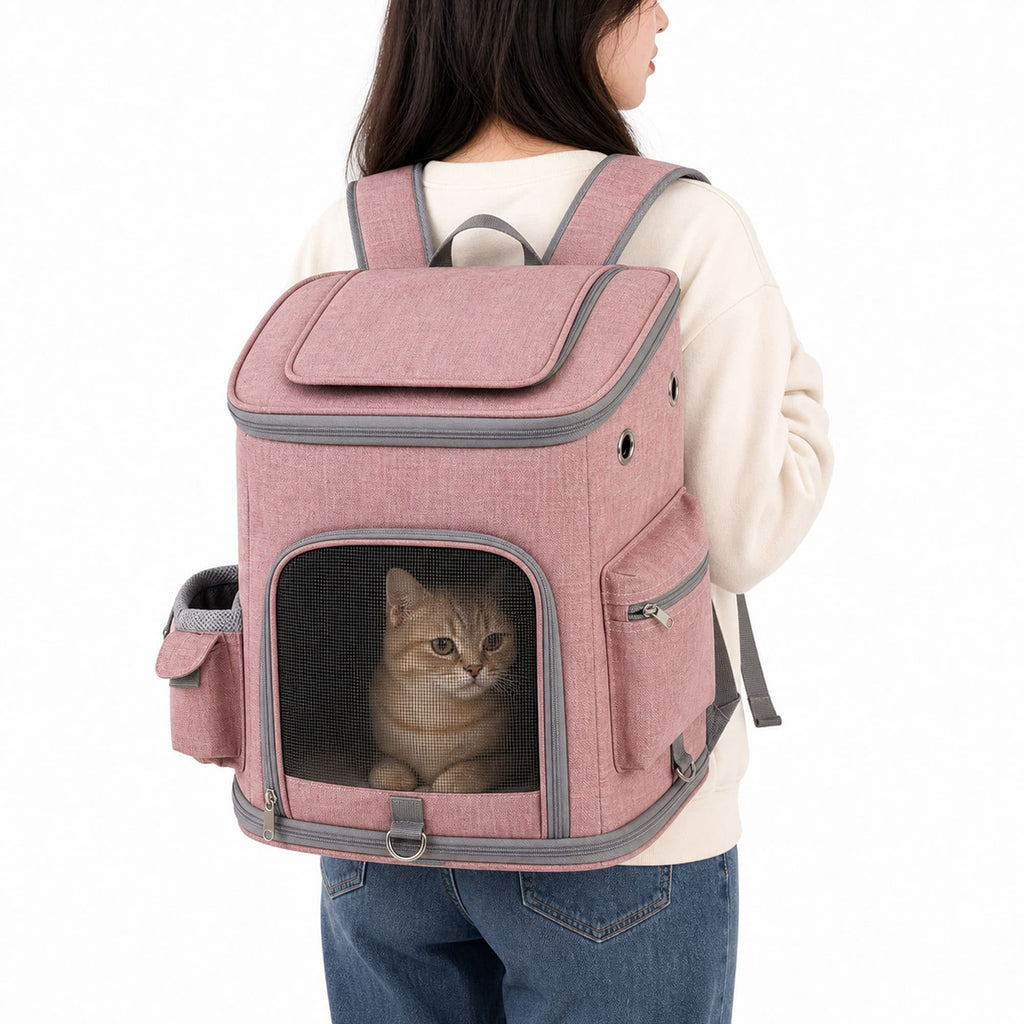 Pink pet carrier backpack worn by person with cat inside front mesh window