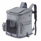 Gray pet carrier backpack with front mesh door, side pockets, and top opening
