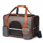 Blue breathable pet carrier tote with mesh windows and side storage pockets