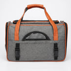 Gray breathable pet carrier tote with mesh windows and side storage pockets
