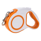 Orange retractable dog leash with ergonomic rubber grip and metal hook