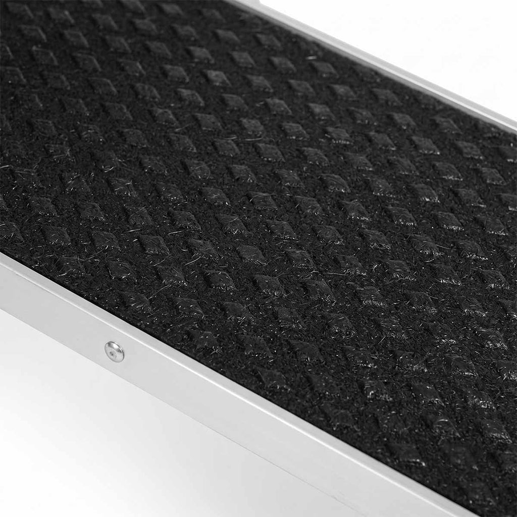 Close-up of textured anti-slip surface on black dog ramp