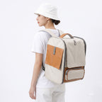 White pet carrier backpack worn by person for hands-free travel