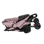 Pink pet stroller folded flat for compact storage and travel