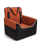 Quilted pet car seat for small dogs and cats with adjustable straps and soft cushion